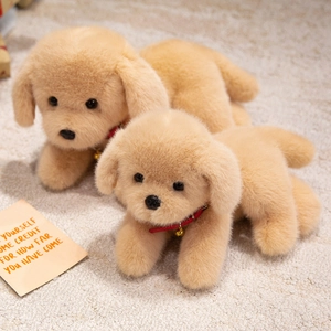 Cute plush Labrador puppies with red collars and golden bells on a cozy beige carpet