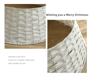 Detailed close-up of white hand-woven Christmas tree collar with fine wicker texture