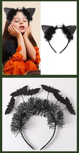 Close-up of sequined cat ears and bat headbands with black feathers for Halloween party
