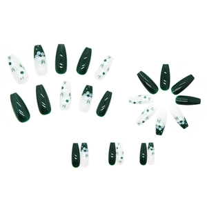 Long coffin press-on nails with green tea leaves and camellia floral art designs