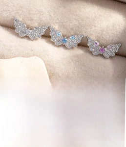 Macro detail of angel wing piercings with zirconia inlays and flat back screw posts
