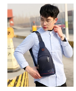 Detail of navy blue waterproof oxford chest bag with SPORT logo and adjustable strap