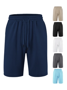 Detail of men's striped waffle shorts showing the elastic waistband and multiple colors