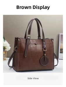 Deep brown tote bag detail with spliced leather texture and gold hardware accents