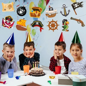 Pirate birthday banner hanging above kids celebrating party with pirate decorations