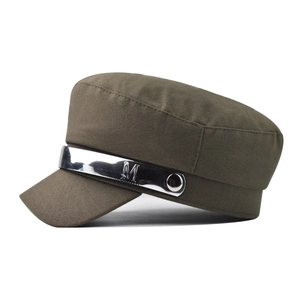 Detail of army green military hat featuring metallic silver band and embossed M detail