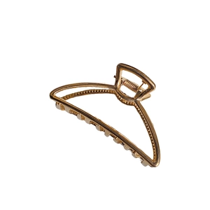 Elegant gold metal shark hair claw clip with a minimalist semi-circular design for women