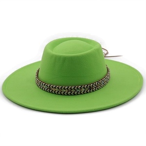 Detail of green flat-top wool hat featuring ethnic woven band and wide brim design