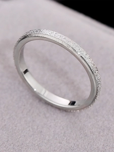 Macro view of matte sandblasted stainless steel ring with polished inner surface