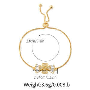 Detail of adjustable gold bracelet with star and heart charms showing size 23cm measurements