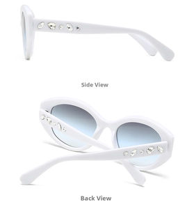 Detail of white oval sunglasses showing marquise rhinestones on the side and back temple