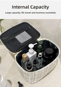 Internal view of tweed cosmetic bag showing spacious main compartment and zipper mesh pocket