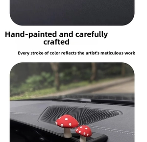 Macro detail of hand-painted red mushroom car ornaments on dashboard, set of two pieces