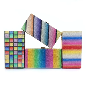 Detailed view of four rectangular evening clutch bags with sparkling colorful rhinestones