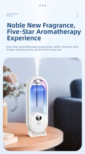 Detail of white aromatherapy diffuser showing digital display and mist outlet on wood table