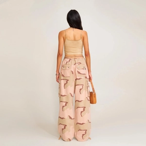 Women's khaki crop top and pink camo cargo pants with side pockets shown from the back view