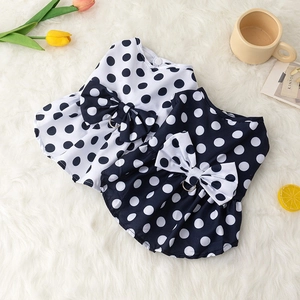 Polka dot pet dress with bow and D-ring, available in navy blue and white colors