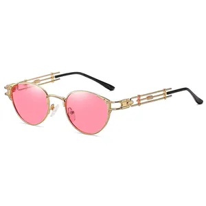 Steampunk round pink sunglasses with golden metal frame and geometric hollow temple arms