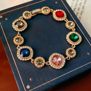 Vintage gold-plated multi-colored gemstone bracelet with sparkling zircon halo settings