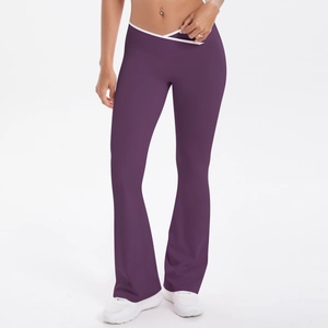 Detail of high-waisted yoga pants featuring V-cross waistband and white contrast piping