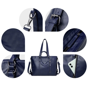 Detailed view of dark blue tote bag with gun-black metal hardware and PU leather texture