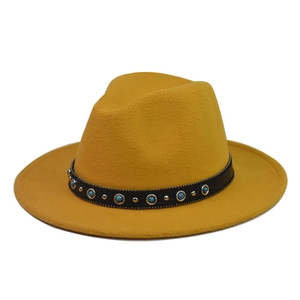 Close-up of ginger yellow wide brim wool fedora hat with turquoise bead leather band