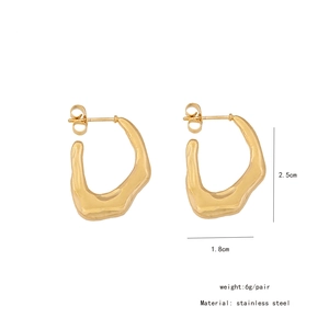Detail view of gold organic irregular earrings with dimensions 2.5cm by 1.8cm