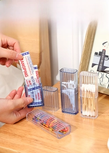 Close-up of portable storage box with vertical stripes for swabs and jewelry