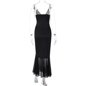 Detail of the black mesh fishtail hemline and delicate lace stitching on a maxi dress