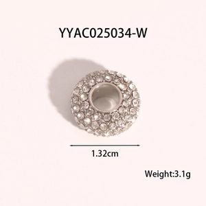 Macro detail of a 1.32cm silver stainless steel charm ball with full rhinestone inlay