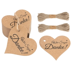 Heart-shaped brown kraft paper gift tags with Wir Sagen Danke text and jute twine