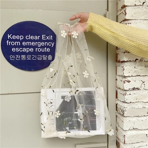 Chic cream mesh tote bag featuring 3D white floral embroidery and stylish top handles