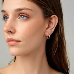 Minimalist gold starry hoop earrings worn by model for high-end fashion styling