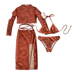 Four-piece rust red marble print swimsuit set with long sleeve mesh cover-up and skirt