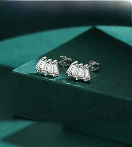 Macro detail of S925 sterling silver square geometric earrings with radiant faux diamonds