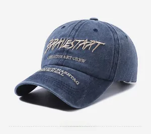Detail of vintage washed navy denim baseball cap with beige BRAVESTART 3D embroidery