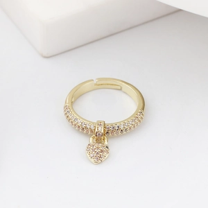 Detailed view of adjustable golden ring with sparkling heart pendant and micro-pave zircons