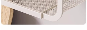 Close-up of white metal wire shelf with natural wooden support rod detail
