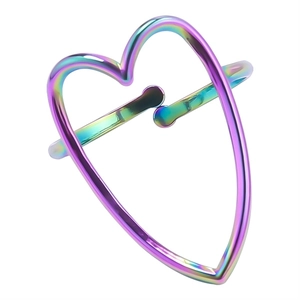 Macro shot of iridescent heart-shaped stainless steel ring with rainbow electroplating