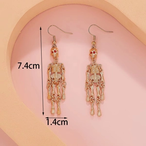 Detailed size view of gold skeleton earrings with red rhinestone eyes and height measurements