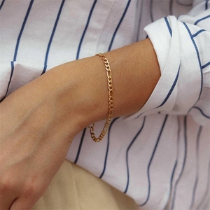 Elegant gold-plated Figaro chain bracelet for women and men in a minimalist style