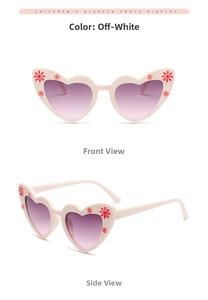 Detail view of heart-shaped cream children sunglasses with floral accents and purple gradient lenses