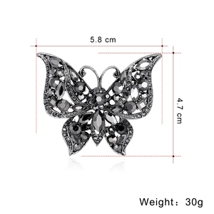 Vintage butterfly brooch with black rhinestones on retro silver base, 5.8cm width