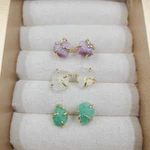 Detailed set of three natural crystal stud earrings in purple white and green stones