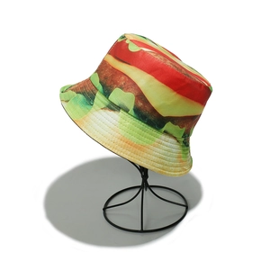 Detailed view of the creative burger print on a reversible cotton bucket sun hat