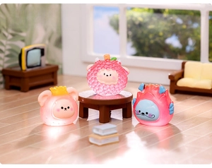 Micro-landscape view of cute fruit-themed animal miniatures in a cozy dollhouse scene