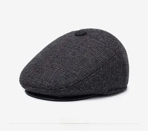 Detailed close-up of dark grey wool blend texture on a vintage men's flat ivy cap