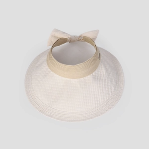 Detail of beige sun hat with quilted brim, khaki woven ribbon and back bow accent