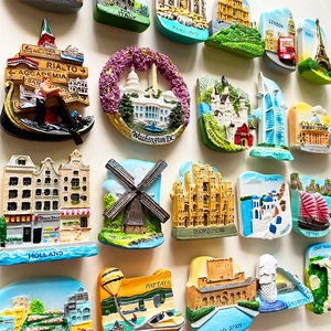 Collection of 3D resin travel fridge magnets featuring global city landmarks on white wall