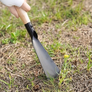 Narrow gardening trowel with black metal head and wooden handle for outdoor planting